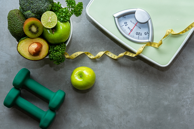 green scale, weights, and bowl of food