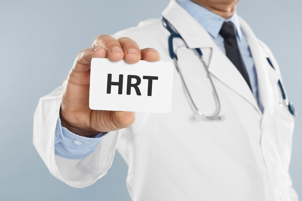 doctor holding sign that says HRT