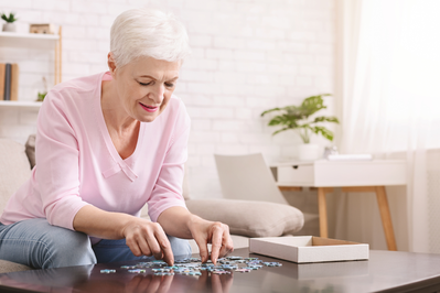 older woman doing a puzzle